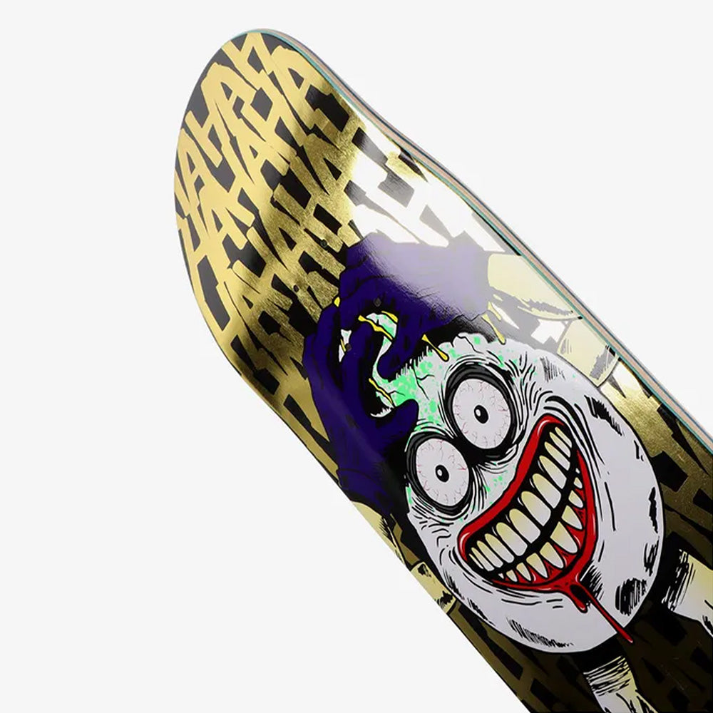 The HEROIN KILLING YOLK SYMMETRICAL EGG skateboard deck by HEROIN features a gold geometric background and the ALLEGORY OF FEAR—a wild face with wide eyes, grinning mouth, hands pulling at its head, and green slime oozing out.
