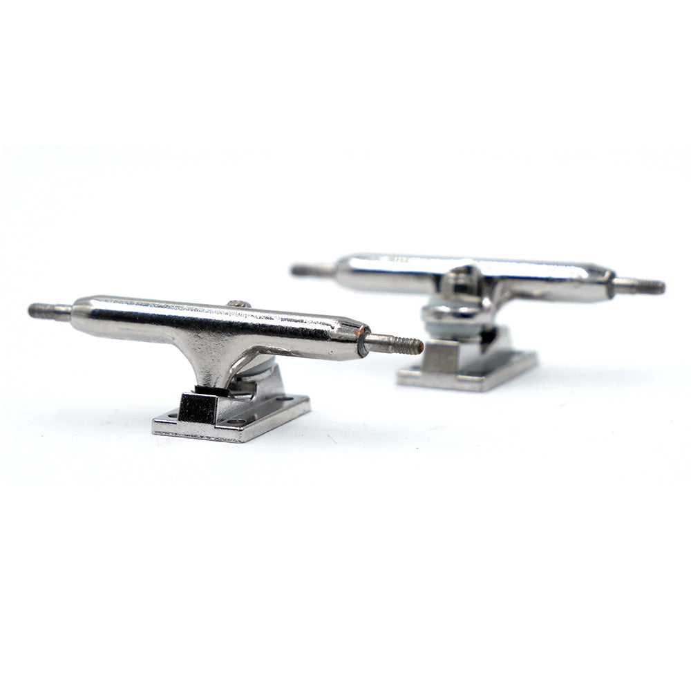 Two SLUSHCULT THOSE TRUCKS V.2 34MM FINGERBOARD TRUCKS in silver are displayed on a white background at different angles, showcasing their premium metal construction.