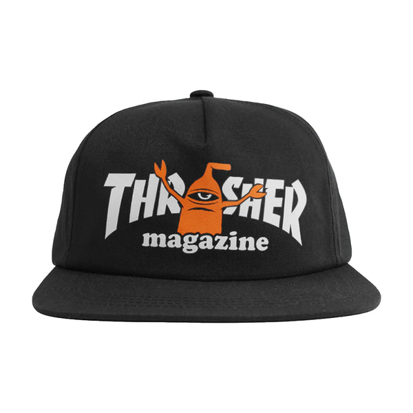 The THRASHER x TOY MACHINE SECT HAT BLACK is a comfy cotton snapback featuring "Thrasher magazine" text and a quirky one-eyed cartoon character with raised arms, making it ideal for any streetwear enthusiast.