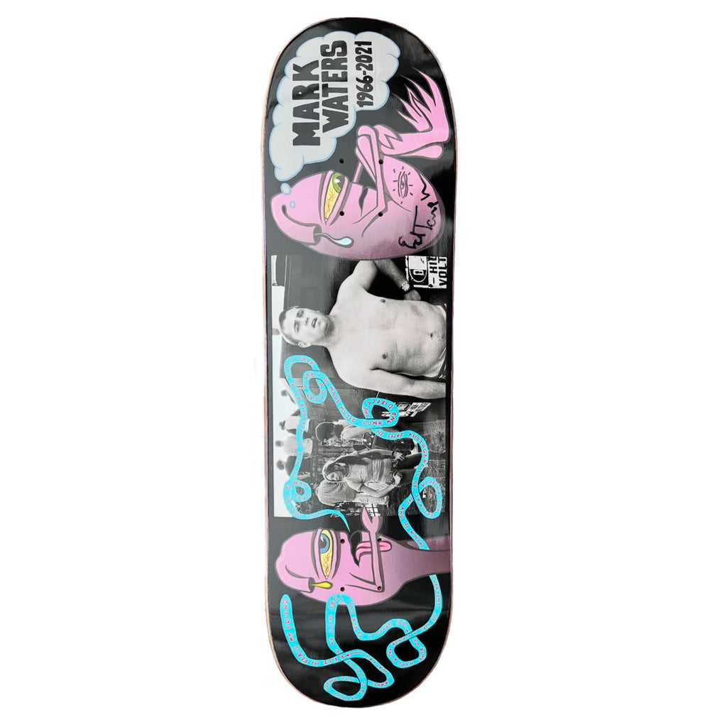 The TOY MACHINE X SKATE SHOP DAY MARK WATERS BY ED TEMPLETON deck by DELUXE showcases pink abstract faces, blue lines, and black-and-white photos. Honoring "Mark Waters 1968-2021," it's ideal for Skate Shop Day fans.