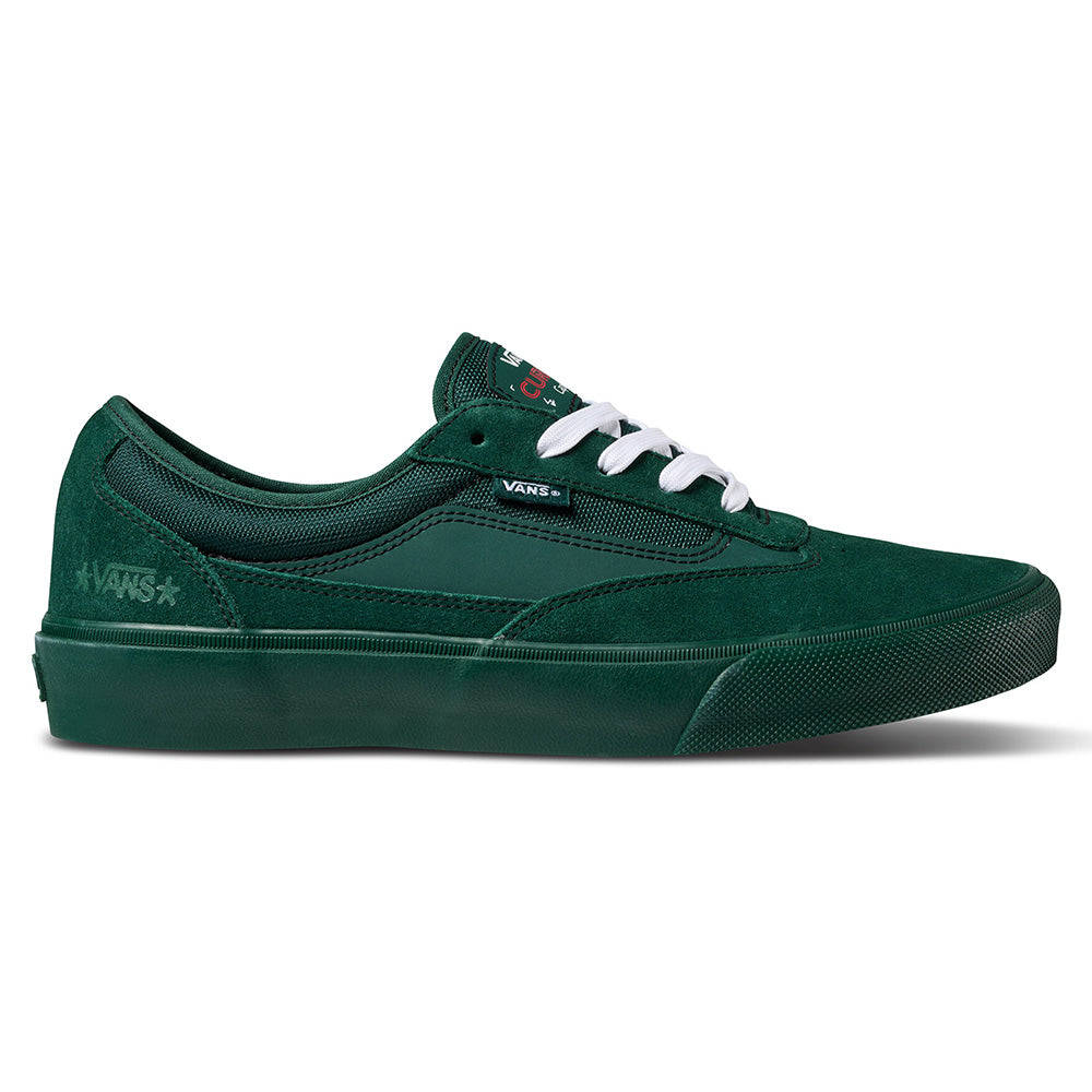 The VANS X ATIBA SKATE CURREN CAPLES EMERALD is a green Vans skateboarding shoe with white laces, black logo tag, emerald textured sole, and POPCUSH insoles for comfort—shown in side profile.