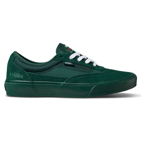 The VANS X ATIBA SKATE CURREN CAPLES EMERALD is a green Vans skateboarding shoe with white laces, black logo tag, emerald textured sole, and POPCUSH insoles for comfort—shown in side profile.