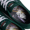 Close-up of emerald VANS X ATIBA SKATE CURREN CAPLES shoes with white laces, highlighting insoles with collaboration branding.