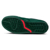 The image shows the green outsole of the VANS X ATIBA SKATE CURREN CAPLES EMERALD by VANS, featuring a black diamond-patterned tread, POPCUSH insoles for comfort, and a curved red accent near the middle.