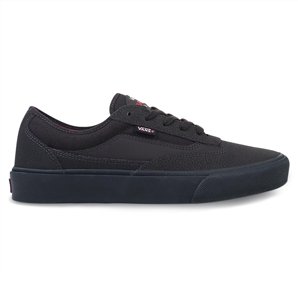The VANS SKATE CURREN CAPLES DARK BROWN sneaker, a low-top design with flat sole and brown laces, features DURACAP reinforcement and is shown from the side against a white background.