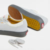 The VANS SKATE CURREN CAPLES GREY sneakers by VANS feature gray and yellow soles, durable DURACAP reinforcement, and come with white laces, shown on a white background.