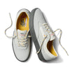 The VANS SKATE CURREN CAPLES GREY sneakers by VANS feature light gray uppers, yellow inner lining, gray laces with yellow accents, dark gray soles, and POPCUSH insoles, displayed on a white background.
