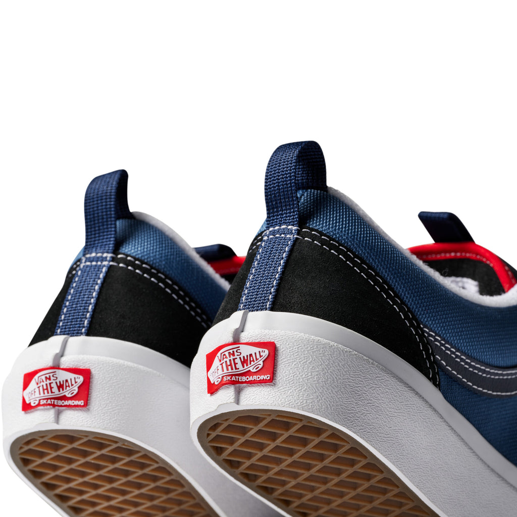 The VANS SKATE OLD SKOOL 36+ in Navy/Red features a red "Vans Off the Wall" logo on the back, SICKSTICK gum rubber for superior grip, and Vans DURACAP reinforcement for enhanced durability.