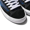 Close-up of the VANS Skate Old Skool 36+ sneakers in navy and red, showcasing white laces with stitching, a swoosh design on the side, and a durable SICKSTICK gum rubber sole.