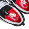 Black and white VANS SKATE OLD SKOOL 36+ sneakers feature suede uppers, highlighting red insoles with the Vans logo and "POPCUSH" text. These Knu Skool kicks embrace a 90s style, combining nostalgic flair with modern comfort.