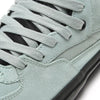 Close-up of VANS SKATE HALF CAB GREY OLIVE / BLACK sneakers, featuring grey laces and black details. These durable VANS skate shoes are ideal for skateboarding.