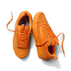 A pair of orange VANS X ATIBA SKATE OLD SKOOL 36+ SOLAR low-top skate shoes, one upright and one on its side, both with laces on a white background—reflecting the iconic VANS style.