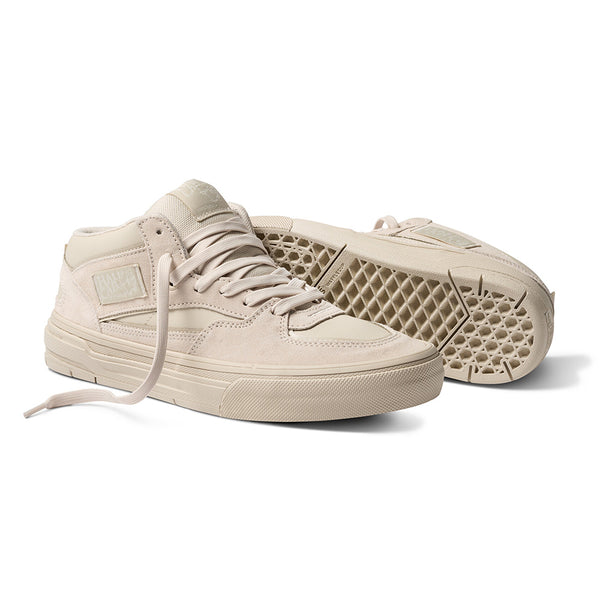 A pair of VANS X ATIBA SKATE HALF CAB WAFFLE CUP OATMEAL BEIGE mid-top sneakers, one upright and the other on its side to display the textured WaffleCup sole.