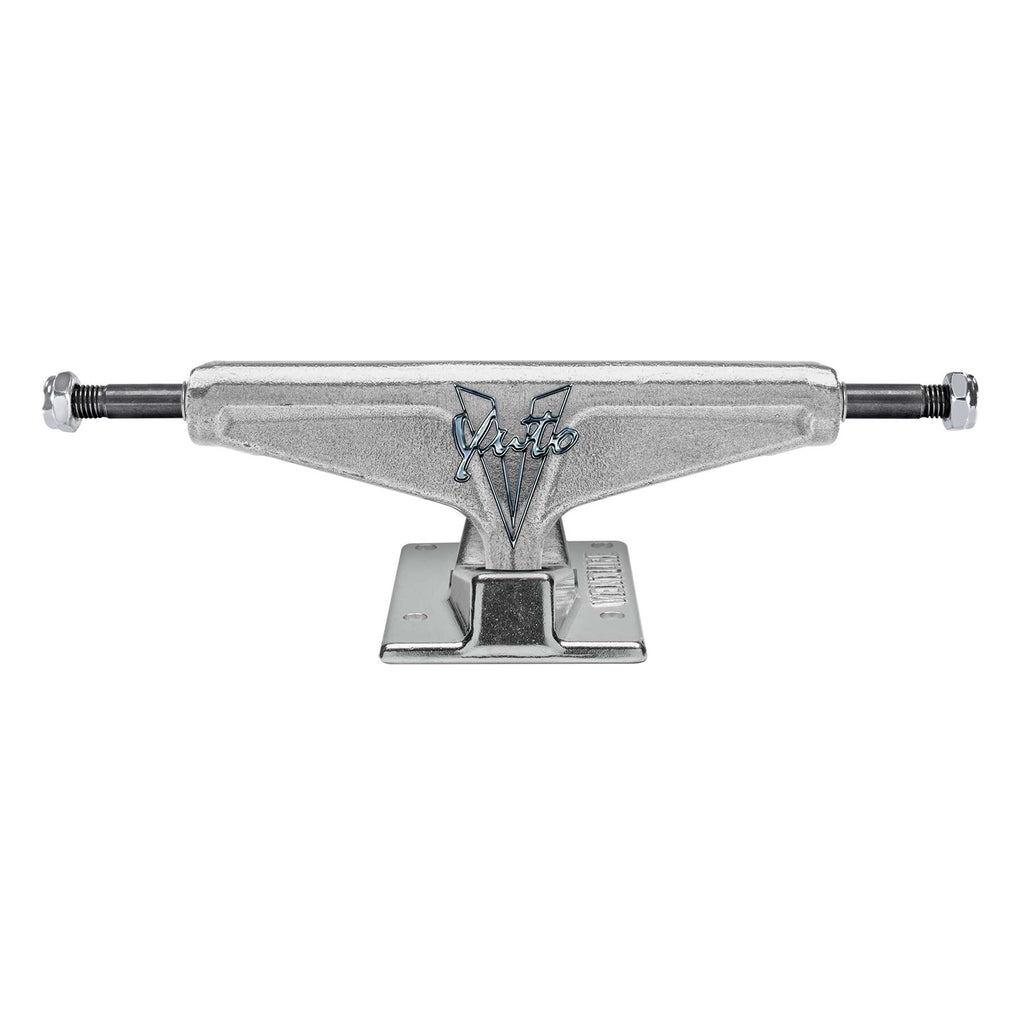 A set of sleek skateboard trucks branded "VENTURE" with a liquid chrome finish, engraved with "Venture '87" at the center and featuring a polished black baseplate.