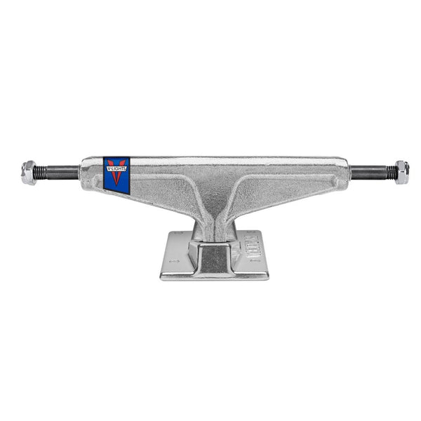 A silver VENTURE skateboard with a blue and red logo on it.