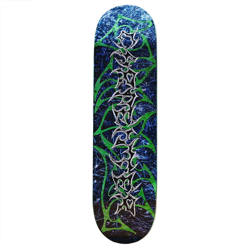 The VINYL CARPENTER CHROME skateboard deck by VINYL features a chrome finish with a blue and green abstract pattern and silver outlined shapes running vertically down the center.