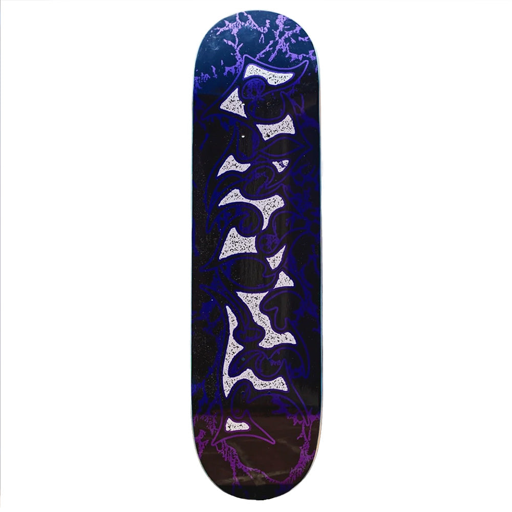 The VINYL METALLIC TRIBAL skateboard deck by VINYL features a bold purple and white tribal graphic with lightning patterns on a dark background, metallic vinyl accents, and measures 8.25 x 31.8 inches.