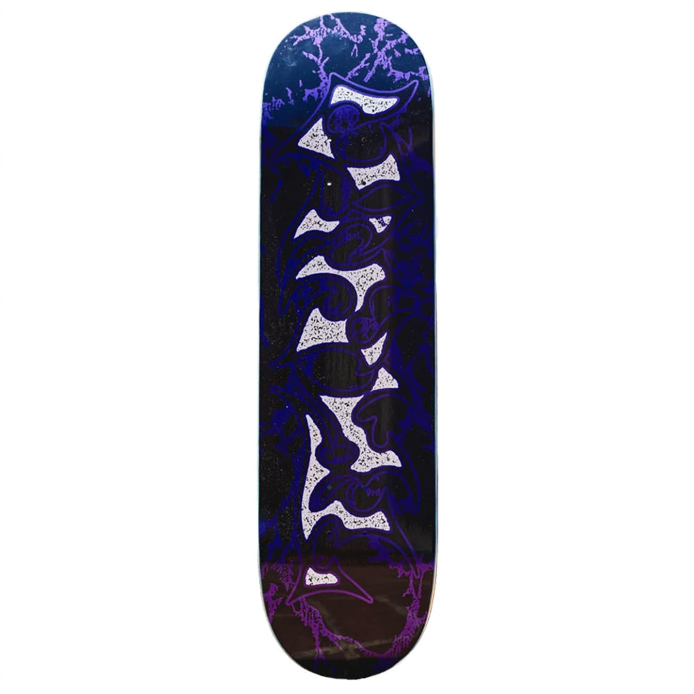The VINYL METALLIC TRIBAL skateboard deck by VINYL features a bold purple and white tribal graphic with lightning patterns on a dark background, metallic vinyl accents, and measures 8.25 x 31.8 inches.