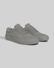The CHAPTER | STONE FG NUBUCK sneakers by WARSAW LTD feature gray full-grain nubuck suede uppers, laces, and rubber soles for a minimalist look, showcased on a plain light background.