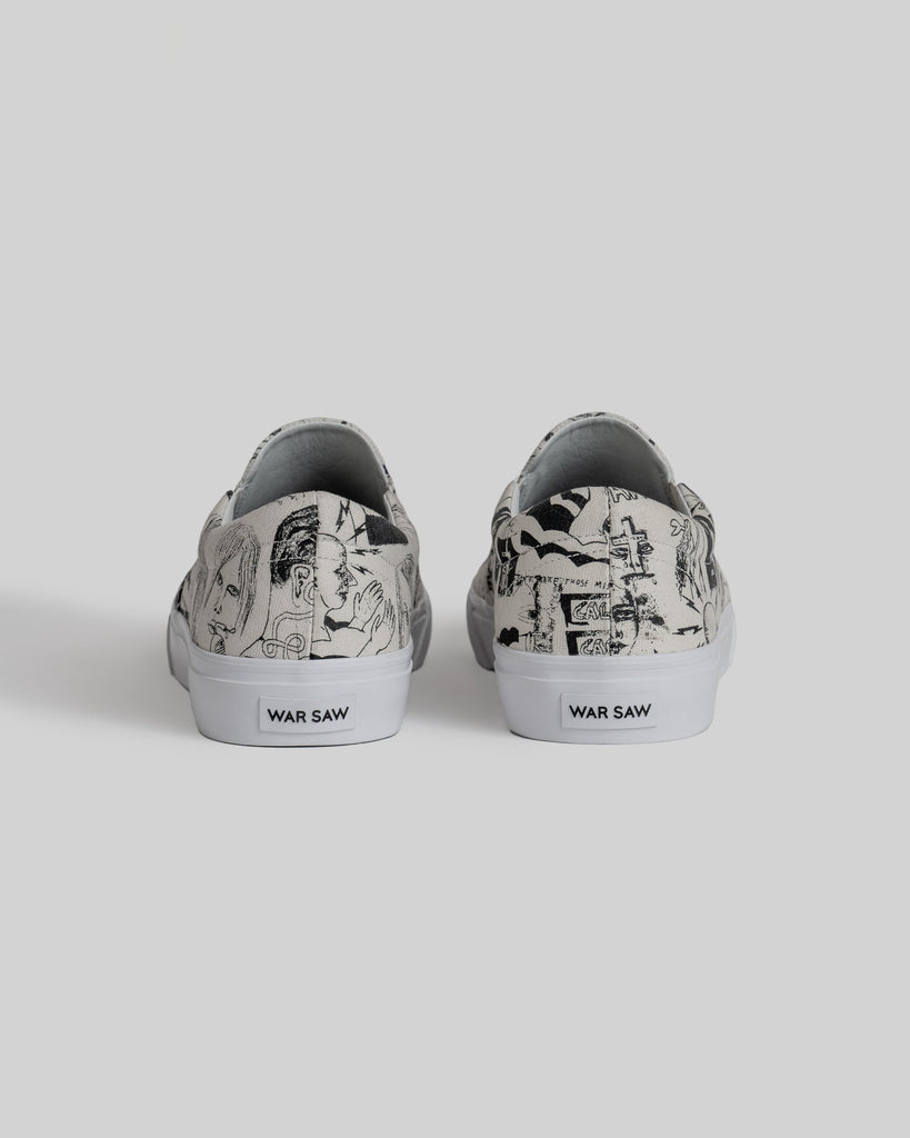 The STRANGER SLIP-ON | TEMPLETON COLLAGE by WARSAW LTD is a limited edition pair of canvas slip-ons with black abstract artwork and "WAR SAW" on the heel tabs, featuring Templeton's signature style.