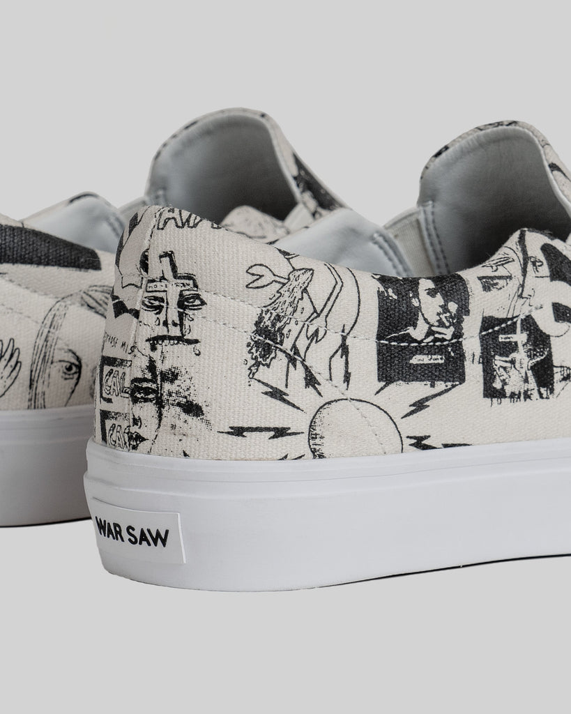 Close-up of the back of two white STRANGER SLIP-ON | TEMPLETON COLLAGE sneakers by WARSAW LTD, featuring black abstract graphics inspired by Ed’s paintings and "WAR SAW" on the heel tab. A true limited edition for skate enthusiasts.
