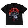 The WELCOME MEDUSA BOXY GARMENT-DYED TEE in black features Medusa's head graphic and bold red "WELCOME" lettering. Front and back designs from WELCOME add extra flair to this standout tee.