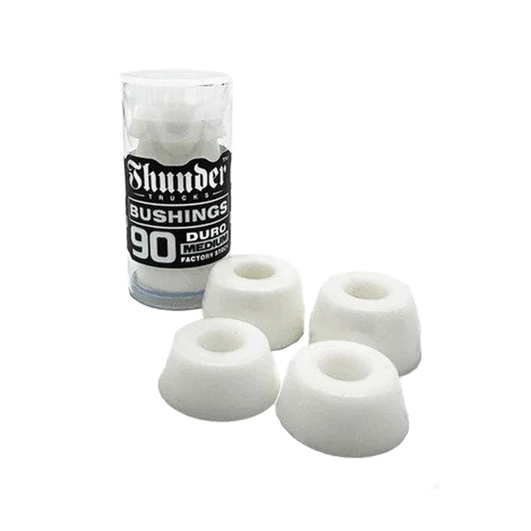 A pack of Deluxe THUNDER PREMIUM BUSHING 90D WHITE foam rollers next to a medium orange bottle.