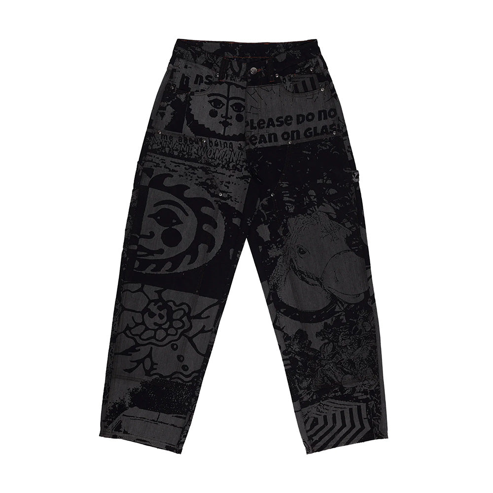The Butter Goods WKND DAMN NEAR CARPENTERS BLACK HORSES are black carpenter denim pants featuring abstract and graphic prints—faces, text, and geometric patterns—shown against a white background.