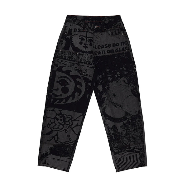 The Butter Goods WKND DAMN NEAR CARPENTERS BLACK HORSES are black carpenter denim pants featuring abstract and graphic prints—faces, text, and geometric patterns—shown against a white background.