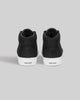 The CHAPTER MID | BLACK / WHITE SYNTHETIC by WARSAW LTD are black high-top sneakers with white soles, "WAR SAW" on the heels, and premium synthetic suede for a skate-inspired style.