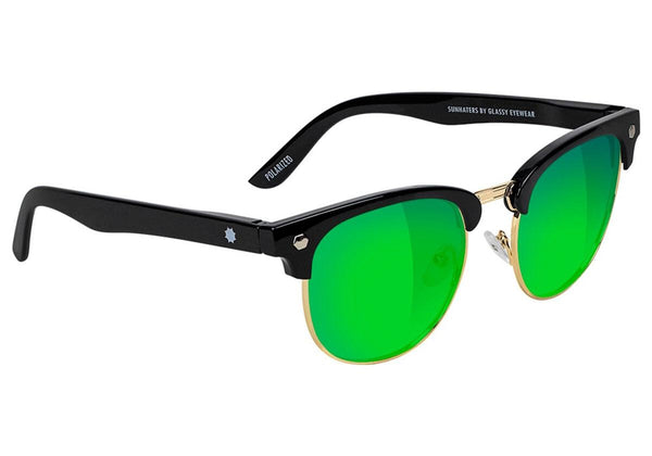A pair of GLASSY SUNHATERS Morrison polarized sunglasses with black frames, green mirror-tinted lenses, and gold accents on the bridge and rims.