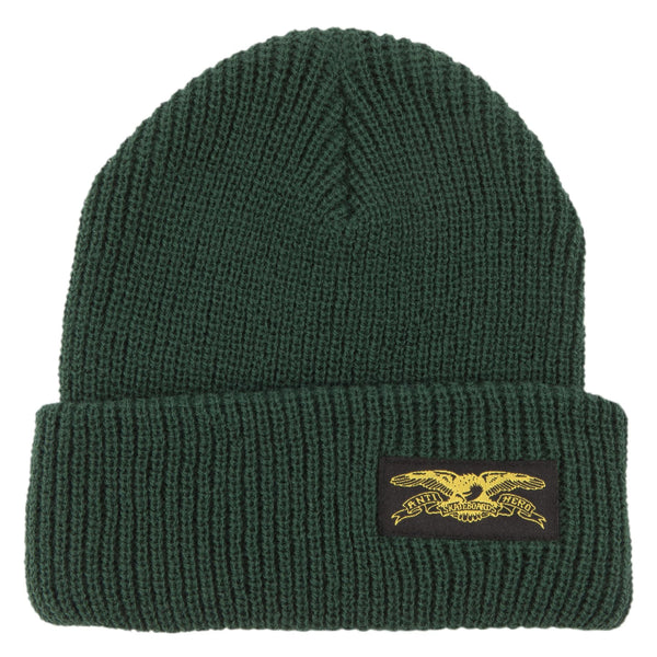 An ANTIHERO dark green beanie with an ANTI HERO STOCK EAGLE LABEL patch on it.