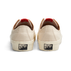 A pair of LAST RESORT AB VM003 CANVAS WHITE/WHITE sneakers with red soles.
