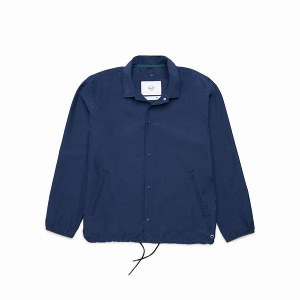 The HERSCHEL SUPPLY CO VOYAGE COACH PEACOAT by HERSCHEL, shown laid flat on a white background, features water-resistant ripstop fabric, a collar, two side pockets, and a drawstring hem.