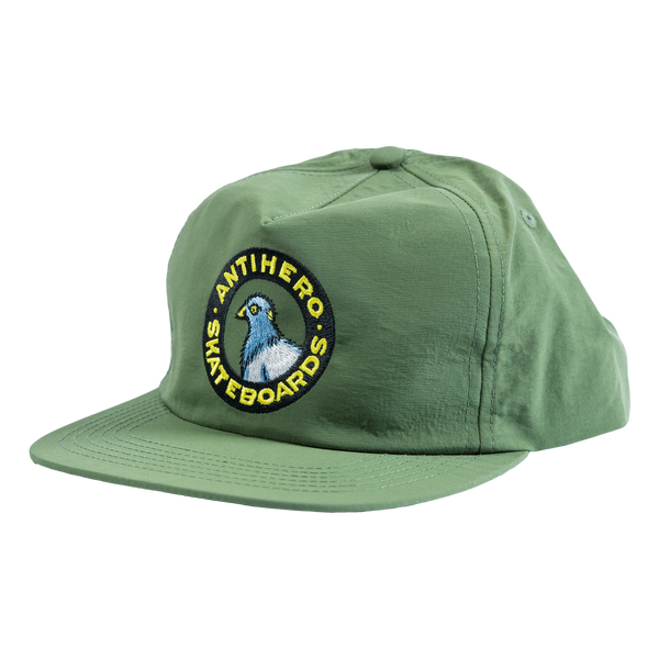 An ANTIHERO PIGEON ROUND SNAPBACK OLIVE hat with the logo of a pigeon.