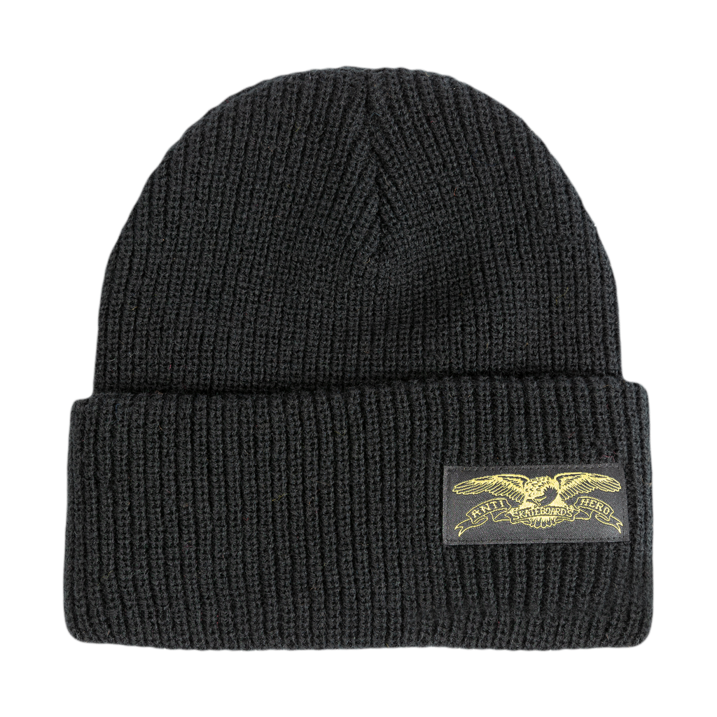 An ANTIHERO black beanie with an ANTIHERO STOCK EAGLE LABEL patch on it, ideal for fans of antihero characters or those looking to add a touch of rebellion to their wardrobe.