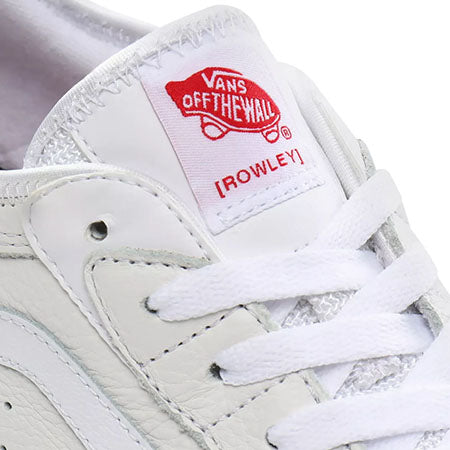 A VANS SKATE ROWLEY WHITE / GUM sneaker with a red and white patch on the side.