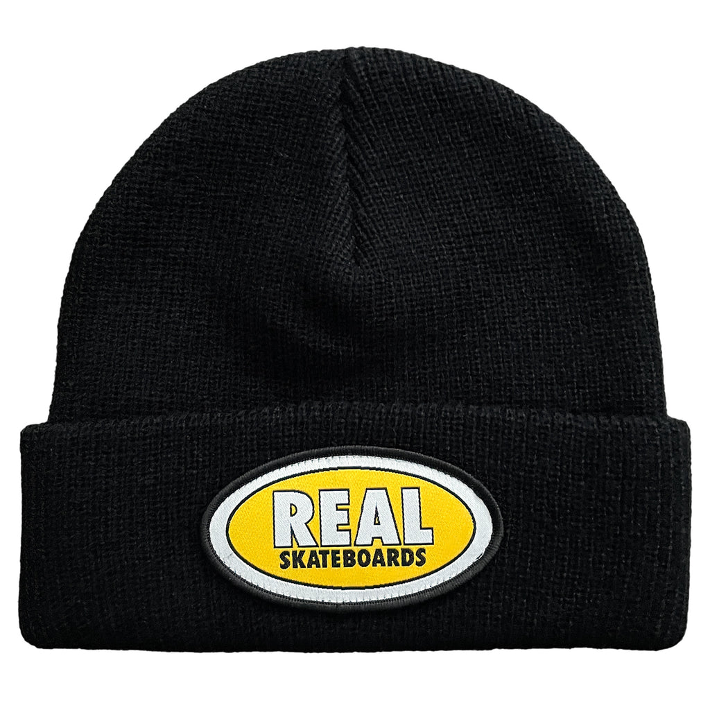 A DELUXE black beanie with a REAL OVAL CUFF BEANIE BLACK / YELLOW patch on it.