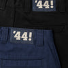 A pair of POLAR '44! pants black with white numbers on them.