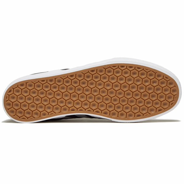 ADIDAS skate shoes with a white sole and a brown sole, perfect for skateboarders looking for durability and style.