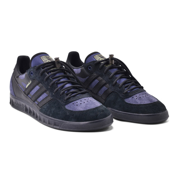 A pair of ADIDAS HANDBALL TOP X MIKE ARNOLD BLACK / DARK BLUE sneakers on a white background.