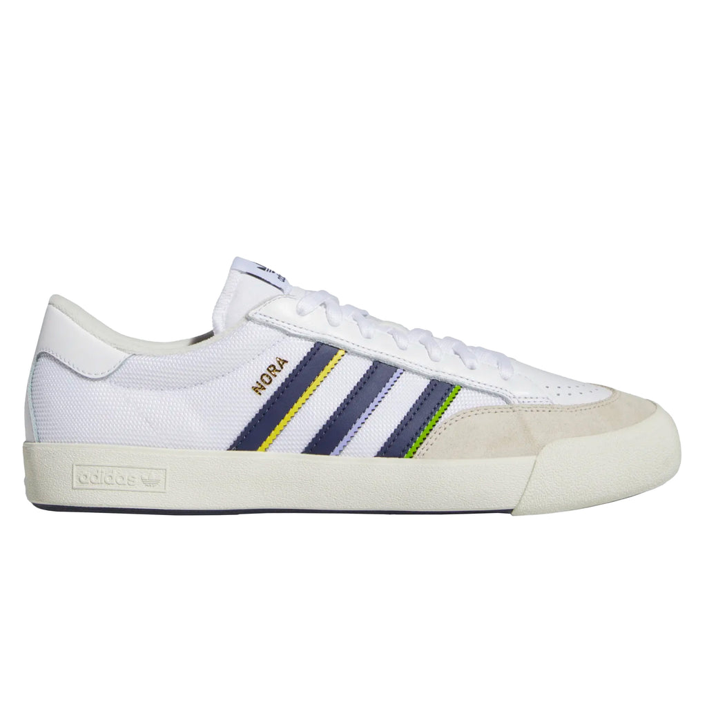 A white and blue ADIDAS NORA GREY ONE/ SHADOW NAVY / GOLD sneakers.