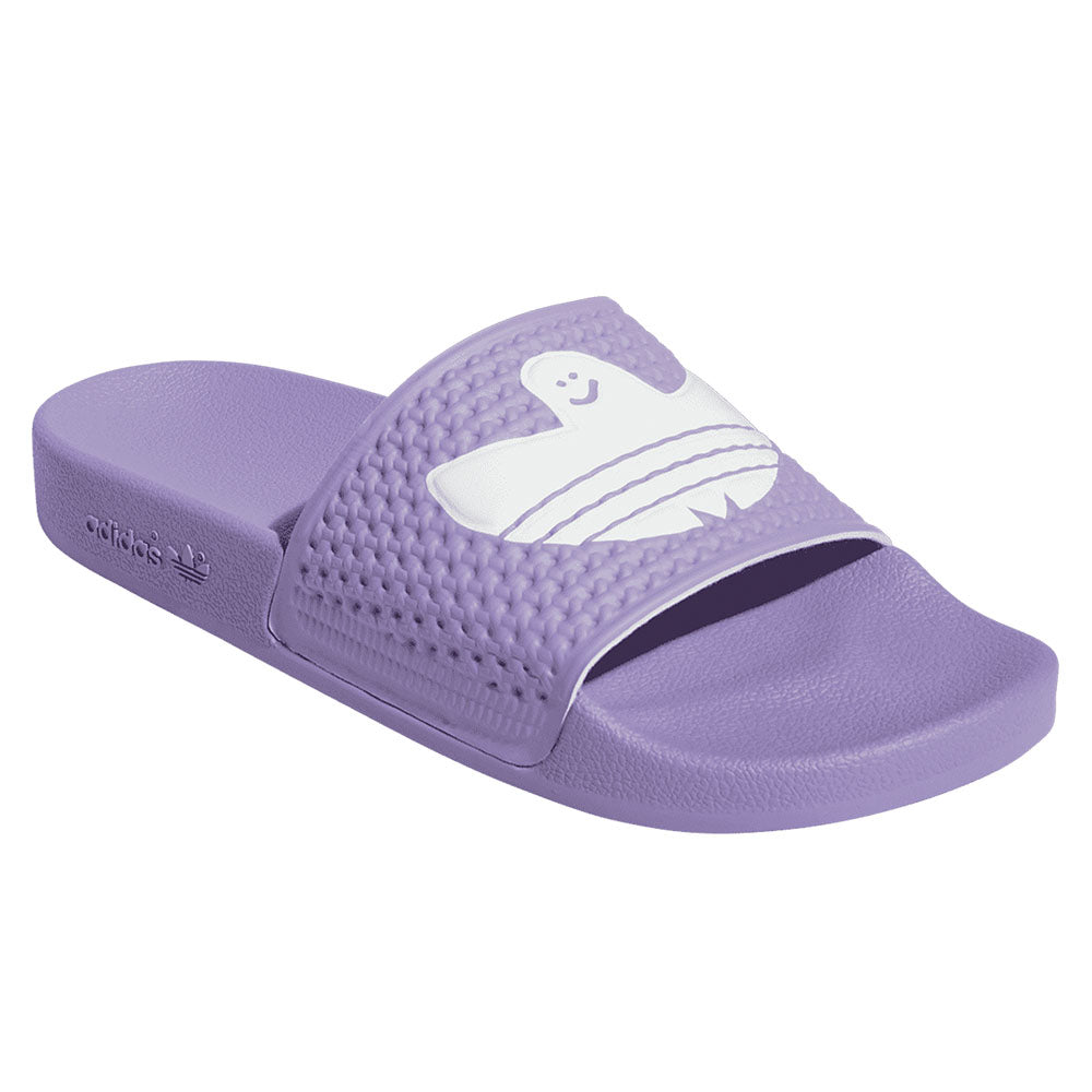 An ADIDAS SHMOOFOIL SLIDE LILAC/WHITE slipper with a ghost on it.