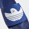 A pair of blue ADIDAS SHMOOFOIL slide sandals with a white logo.