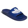 A blue and white ADIDAS SHMOOFOIL SLIDE VICTORY BLUE / WHITE slipper with a shark on it.