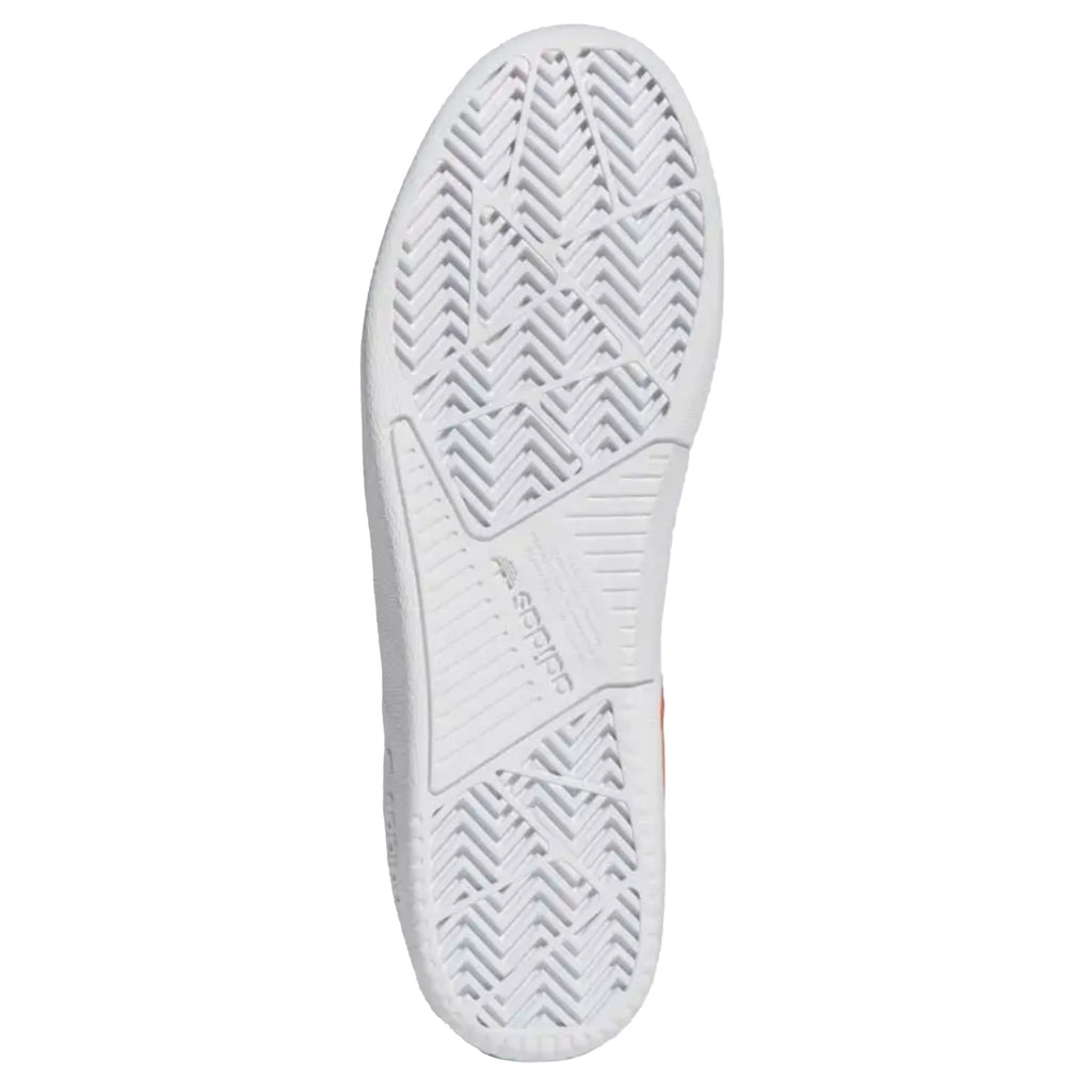 An Adidas Tyshawn Low Collegiate Orange/Collegiate Orange/White tennis shoe with a white sole.