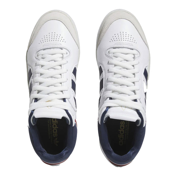 A pair of ADIDAS TYSHAWN WHITE / COLLEGIATE NAVY / GREY ONE sneakers on a white background.
