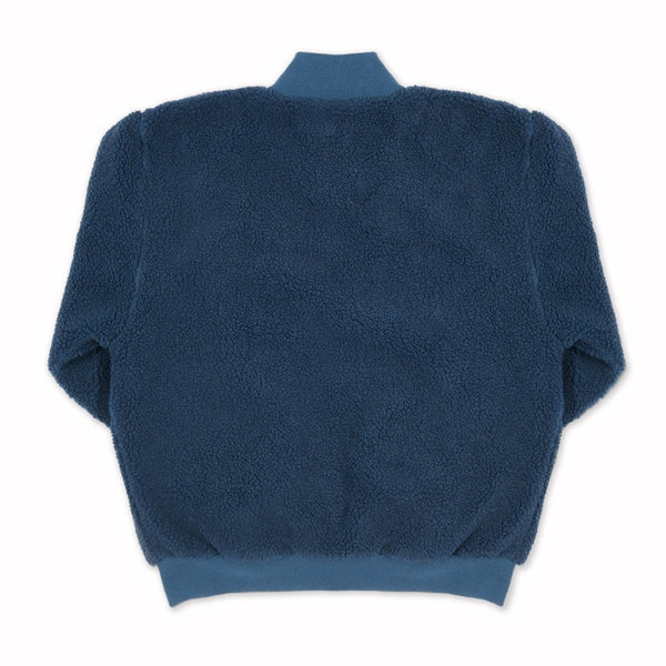 A Mineral Blue ADIDAS x Blondey Sherpa Crew long-sleeve fleece is laid flat, back side up, against a white background, evoking the signature cozy vibe of this ADIDAS jacket.