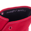 An AUTHENTIC red VANS SKATE ALLEN X HOCKEY shoe with the word Andrew Allen written on it.