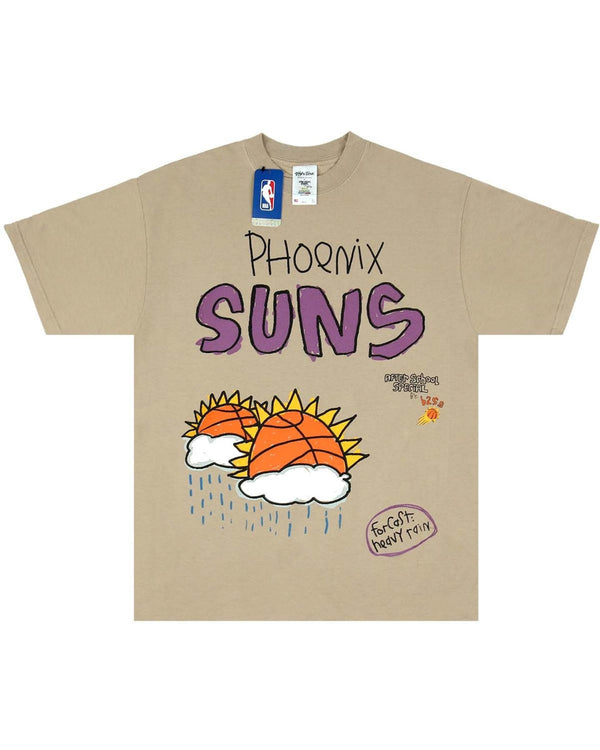 The A.S.S. X SHAKA WEAR X NBA SUNS TEE OATMEAL from AFTER SCHOOL SPECIAL is a beige tee displaying "Phoenix Suns" in purple, accompanied by two basketballs with sun rays above clouds and raindrops. An NBA tag near the collar signifies its authenticity. This premium heavyweight garment dyed shirt provides both durability and style.